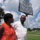 In this Aug. 16, 2017 photo, the Rev. Nelson Johnson and his wife, Joyce, stand beside a historical marker for the “Greensboro Massacre” in Greensboro, N.C. Near that spot on Nov. 3, 1979, Nazis and members of the Ku Klux Klan attacked marching workers, leaving five dead and Johnson injured.